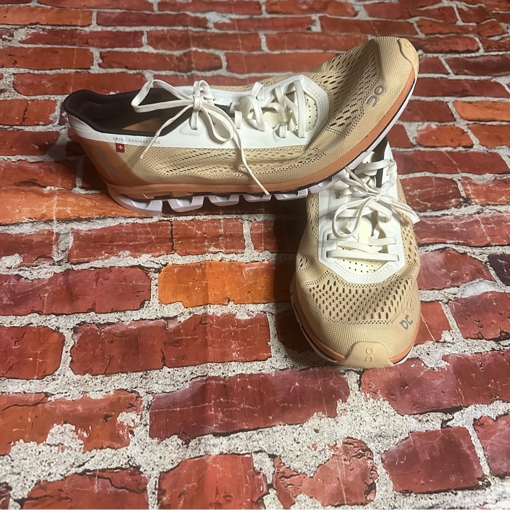 On Cloud Running Tan and White Athletic Shoes